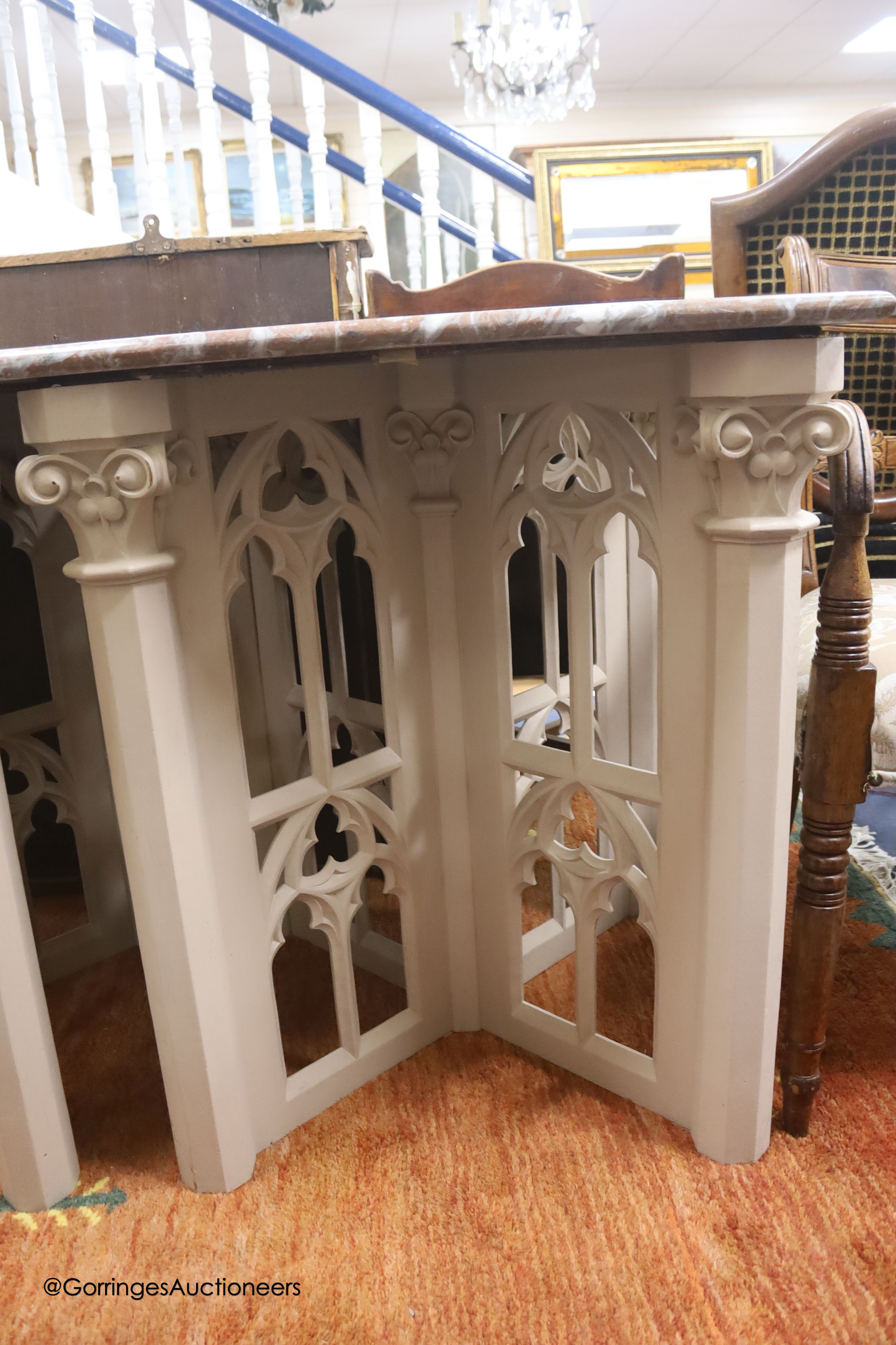 A pair of modern square tables in Gothic style, marble tops
